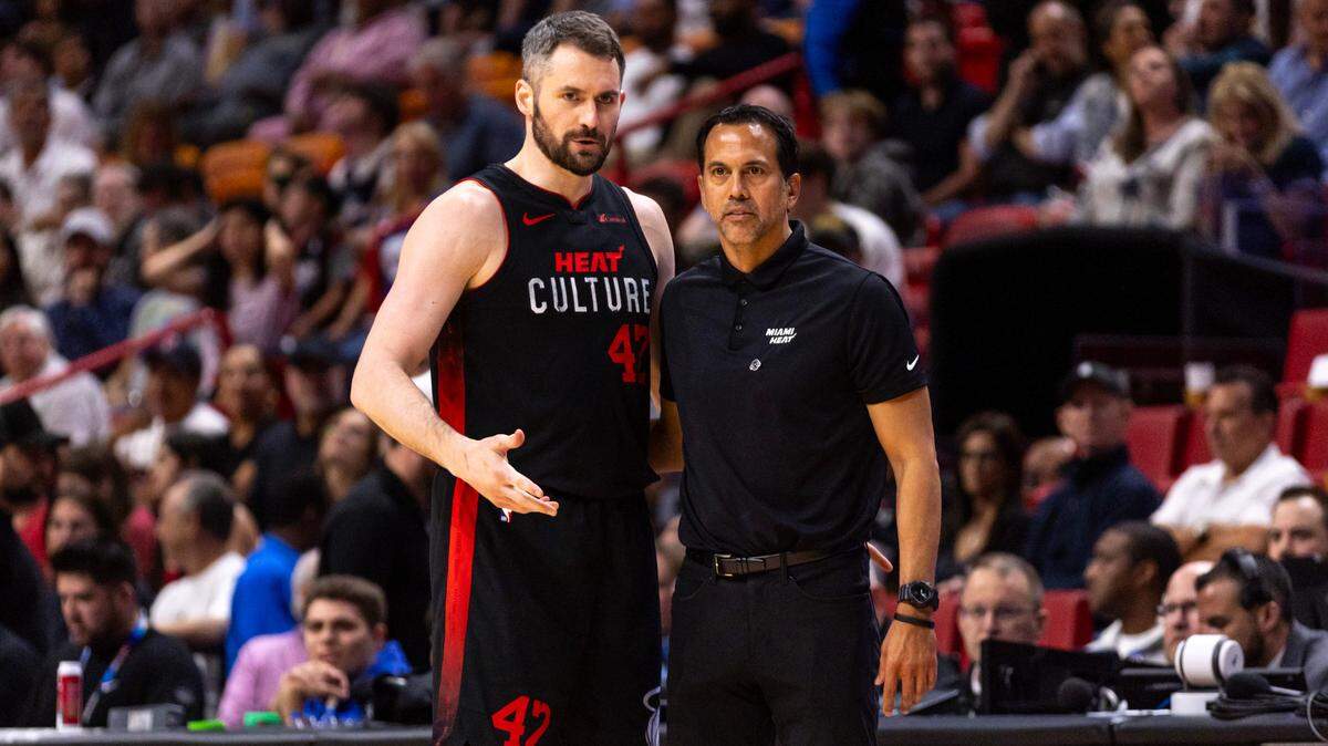 Miami Heat forward Kevin Love (42) speaks with Head Coach Erik Spoelstra during the second half of an NBA game at Kaseya Center in Miami, Florida, on Thursday, April 4, 2024.