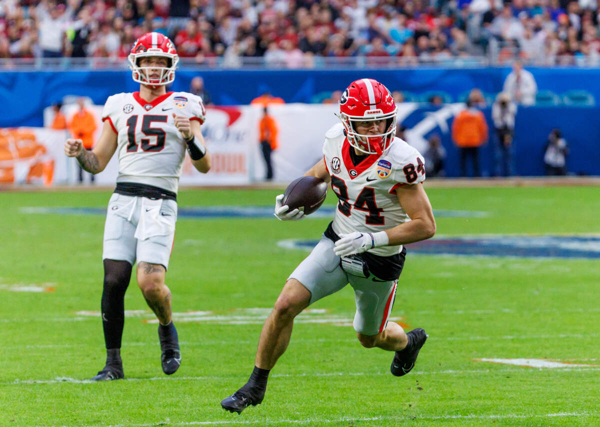 Georgia Bulldogs wide receiver Ladd McConkey (84) runs for a touchdown during the second half of the 90th annual Capital One Orange Bowl against the Florida State Seminoles at Hard Rock Stadium on Saturday, Dec. 30, 2023 in Miami Gardens, Fla.