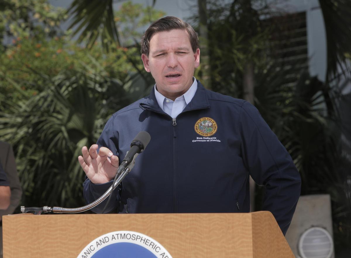 Florida Gov. Ron DeSantis speaks to the media outside the National Hurricane Center during a press conference about the status of Hurricane Dorian on Thursday, Aug. 29, 2019, in Miami.