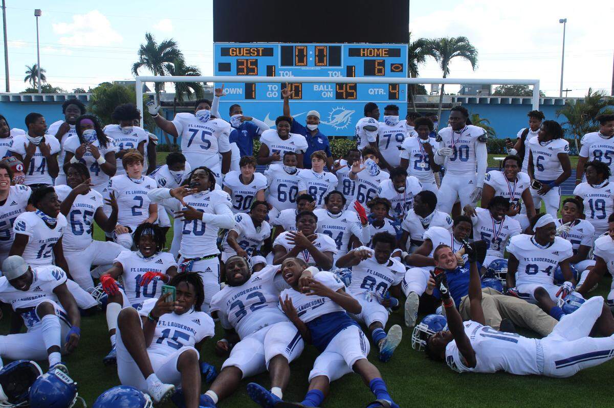 Fort Lauderdale players celebrate their big 35-6 win over South Broward to win the Tri-County 7A Silver championship on Saturday afternoon at Traz Powell Stadium.
