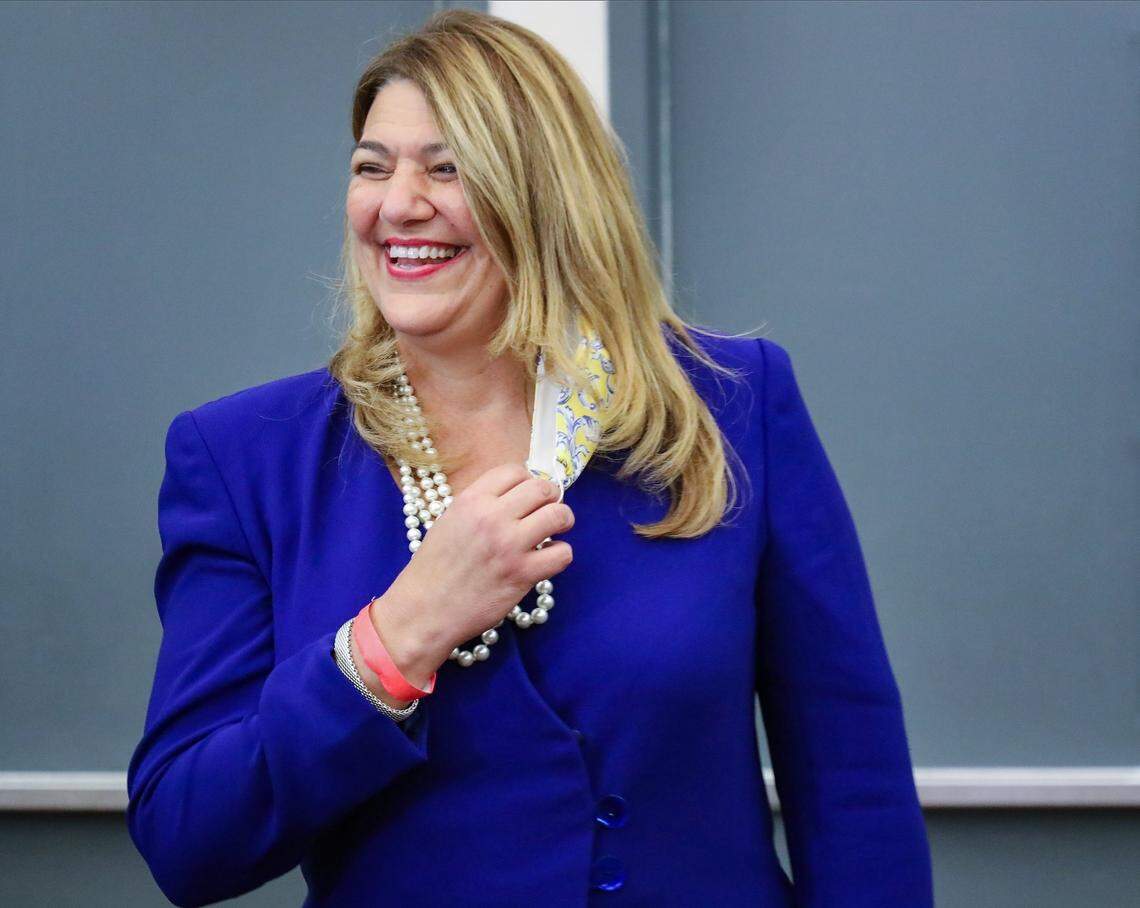 Madeline Pumariega smiles as she enters the room after the Board of Trustees selected her as the new president of Miami Dade College, Nov. 17, 2020.