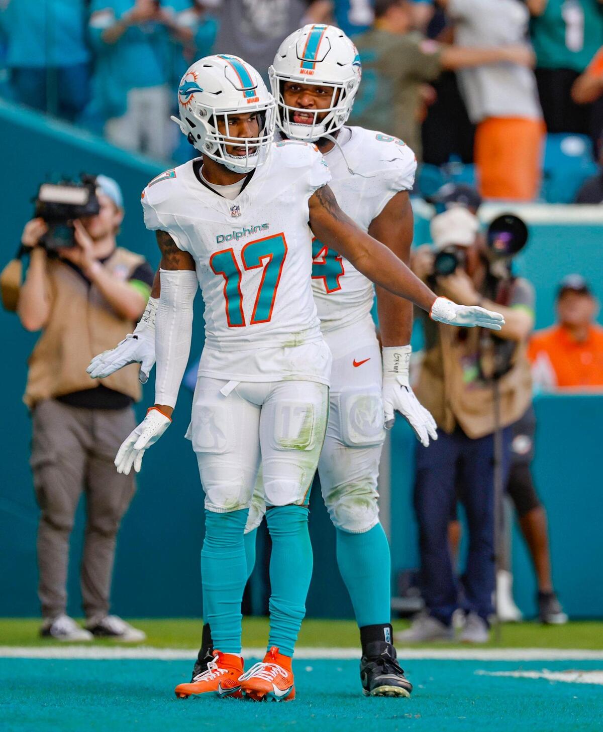 Miami Dolphins wide receiver Jaylen Waddle (17) and Christian Wilkins (94) celebrate Waddle’s touchdown catch against the New York Jets in the second quarter at Hard Rock Stadium on Sunday.