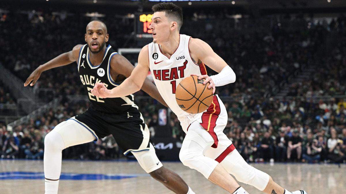 Miami Heat guard Tyler Herro (14) drives to the basket against Milwaukee Bucks forward Khris Middleton (22) in the first half during game one of the 2023 NBA Playoffs at Fiserv Forum.