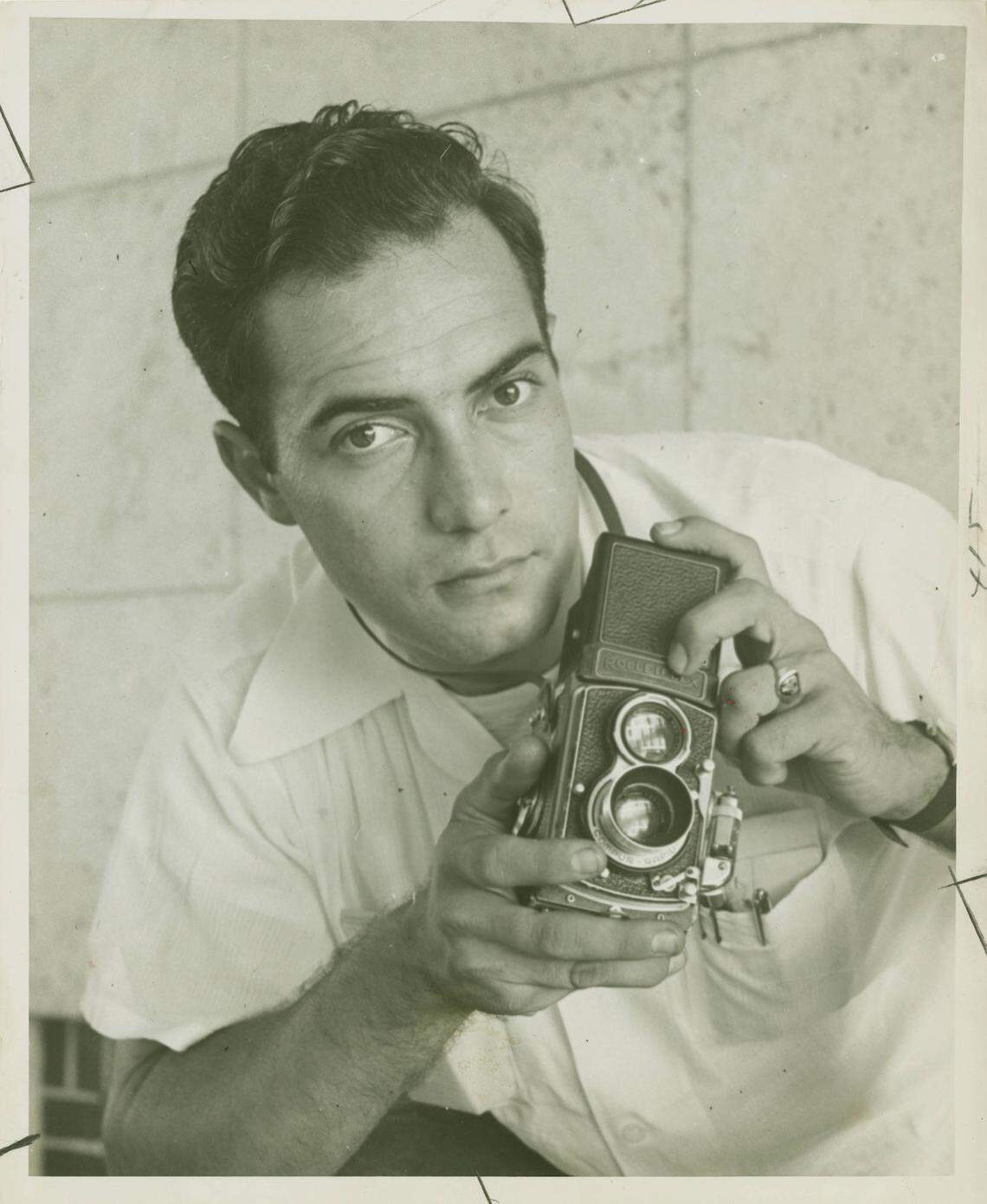 Ray Fisher, then 28, posing with his camera at the University of Miami on May 23, 1952. 