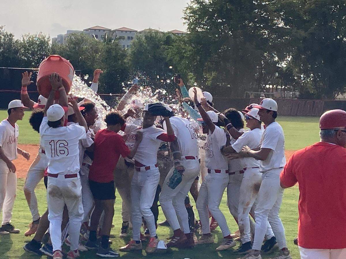 Miami Christian’s baseball team celebrates after beating Fort Pierce John Carroll Catholic 6-3 in the Region 4-2A championship game on Tuesday at Miami Christian School.