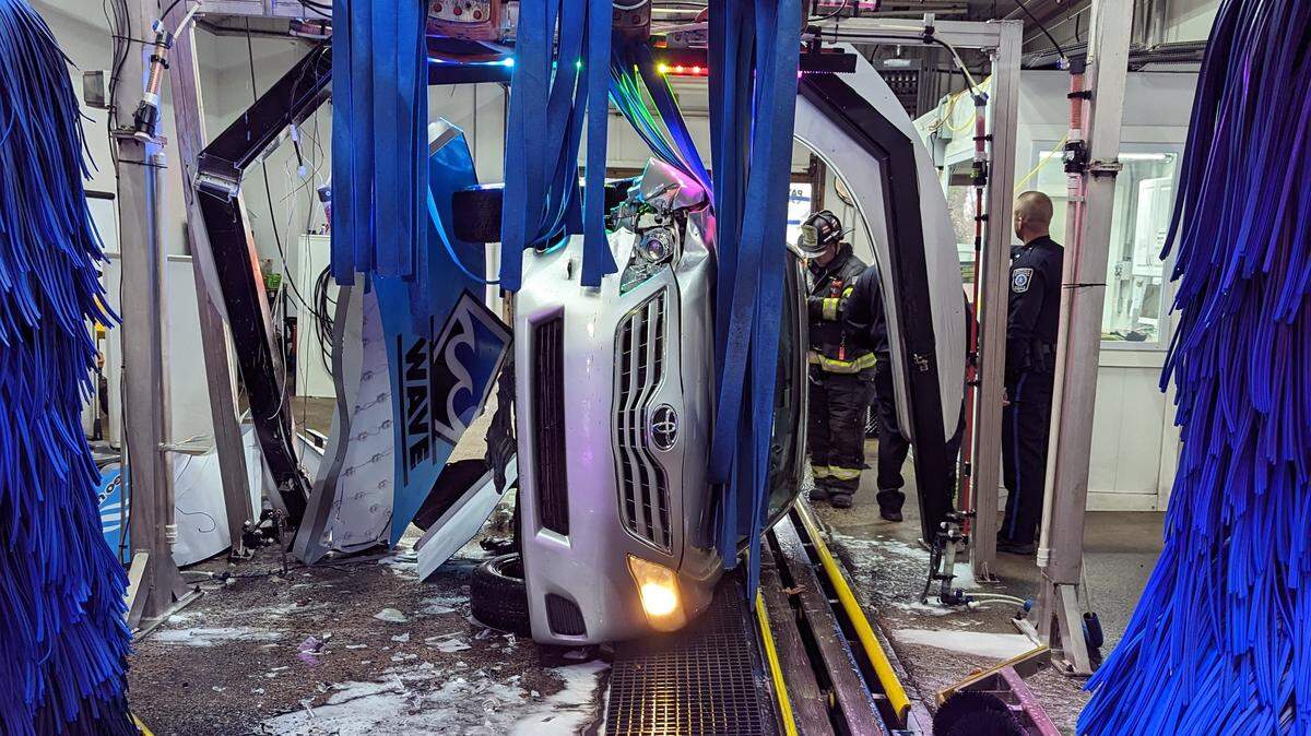 A 77-year-old driver was trapped in his vehicle when it overturned in a Pennsylvania car wash, officials say.
