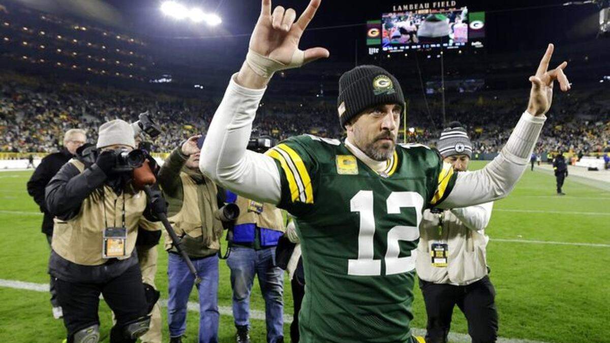 Green Bay Packers quarterback Aaron Rodgers (12) celebrates as he walks off the field following the team’s 31-28 overtime win in an NFL football game against the Dallas Cowboys on Sunday, November 13, 2022, in Green Bay, Wisconsin.