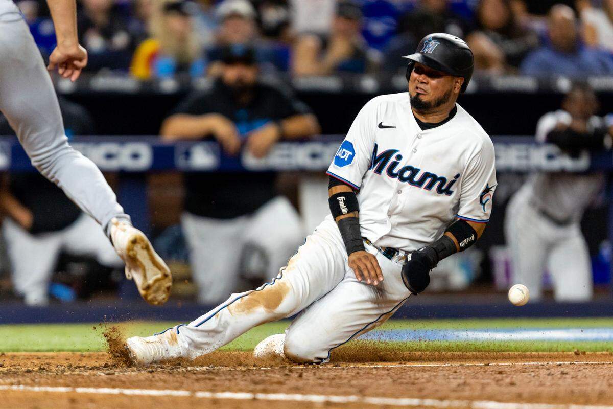 Miami Marlins base runner Luis Arraez (3) scores a run due to a wild pitch by Kansas City Royals pitcher Jackson Kowar during the seventh inning of an MLB game at loanDepot park in the Little Havana neighborhood of Miami, Florida, on Tuesday, June 6, 2023.