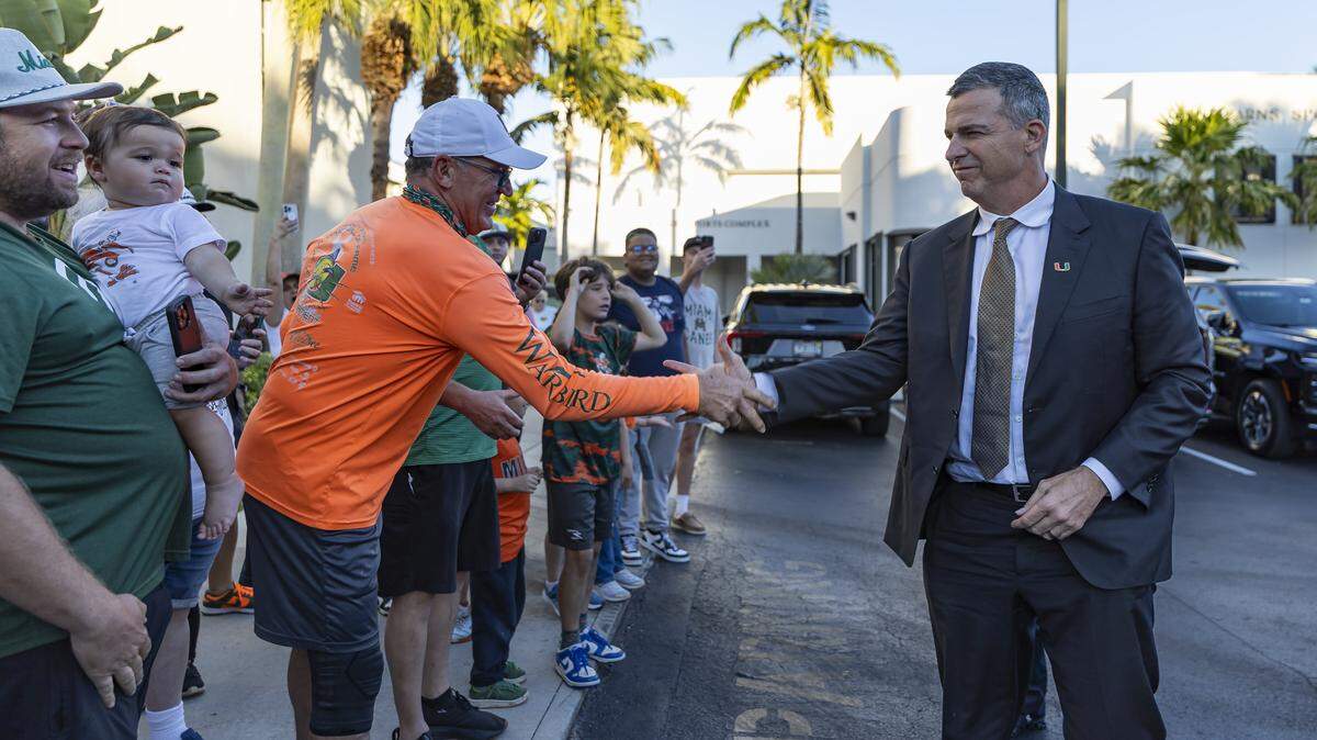 Miami Hurricanes head coach Mario Cristobal greets fans after arriving to the Hecht Athletic Center on Friday, Jan. 9, 2025, in Coral Gables, Fla. The University of Miami returned home after winning the Fiesta Bowl on Thursday against Ole Miss at State Farm Stadium in Glendale, Ariz.