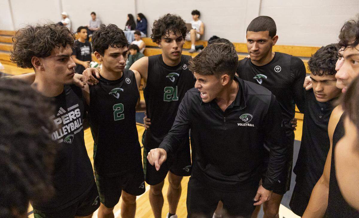Varela Vipers head coach Sebastian Abreu talks with his players before they play against the Columbus Explorers in their GMAC volleyball tournament championship match at Christopher Columbus High School on Thursday, April 9, 2026, in Miami, Fla.