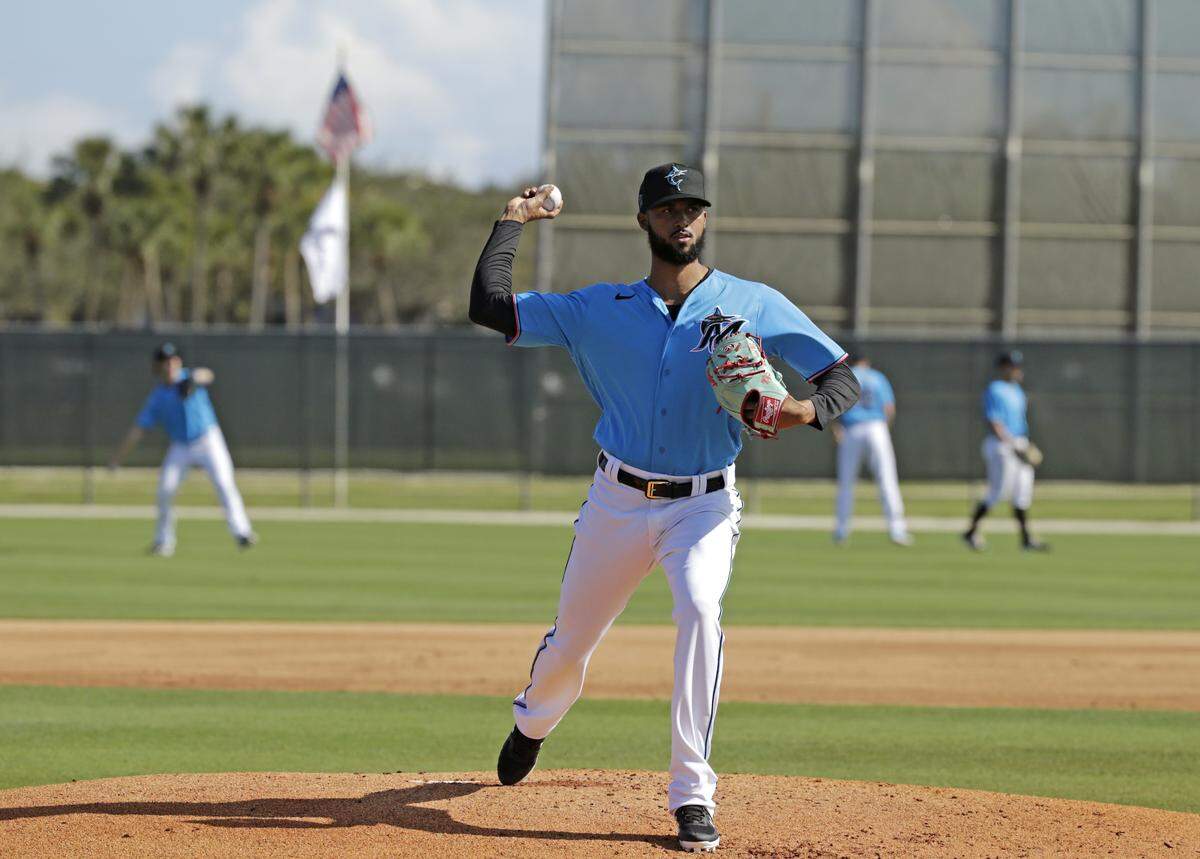 Miami Marlins pitcher Sandy Alcantara (22) pitches during the first full-squad spring training workout at Roger Dean Stadium on Monday, February 17, 2020 in Jupiter, FL.