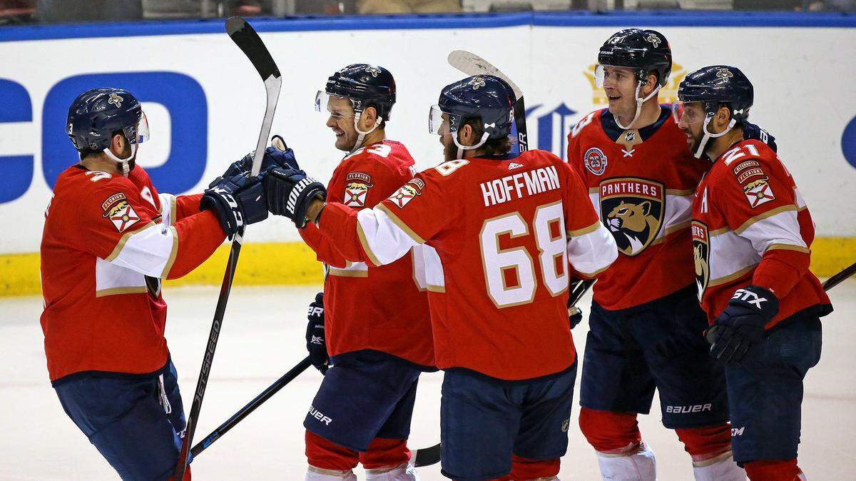 The Florida Panthers’ Evgenii Dadonov (63) celebrates with teammates after scoring during the second period against the Calgary Flames at the BB&T Center in Sunrise, Fla., on Thursday, Feb. 14, 2019. (David Santiago/Miami Herald/TNS)