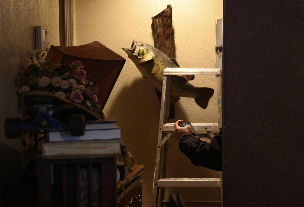 Oscar Valdes of Maso Restoration takes pictures and notes Monday as he assesses the damage to Paul Guerrero’s home due to last week’s heavy rain.