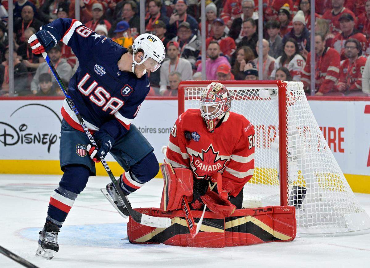 Feb 15, 2025; Montreal, Quebec, CAN; Team Canada goalie Jordan Binnington (50) stops Team United States forward Matthew Tkachuk (19) in the first period during a 4 Nations Face-Off ice hockey game at the Bell Centre.