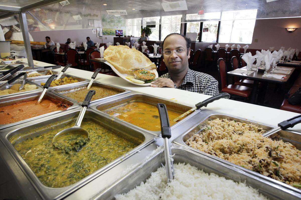 At the Woodlands, a vegetarian Indian cuisine restaurant in Lauderhill, Prasad Naik shows a specialty in 2007.