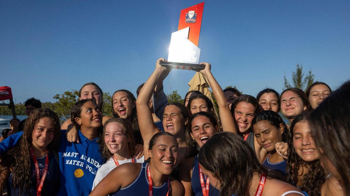 MAST Academy cheers after beating Miami Beach in the GMAC girls water polo finals on Wednesday, March 20, 2024, at MAST Academy on Virginia Key.