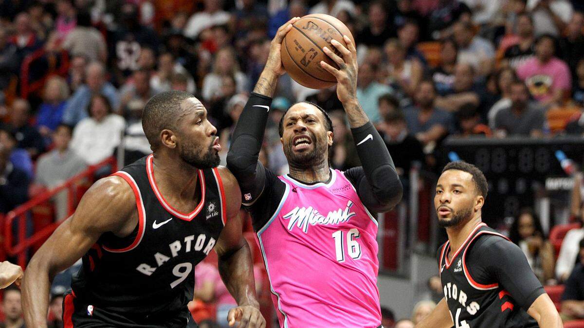Heat forward James Johnson goes to the basket against Raptors’ forward Serge Ibaka in a Dec. 26 game. Johnson is expected to play at least a bit more with the injury to Derrick Jones Jr.