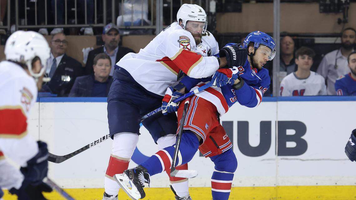 May 22, 2024; New York, New York, USA; Florida Panthers defenseman Aaron Ekblad (5) hits New York Rangers left wing Artemi Panarin (10) during the first period of game one of the Eastern Conference Final of the 2024 Stanley Cup Playoffs at Madison Square Garden.