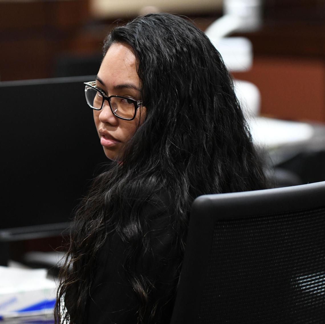 Katherine Magbanua looks over her shoulder as her defense attorneys enter the courtroom Friday, Oct. 11, 2019. A mistrial was declared in the case against her, and the prosecutor said she will start over in a new case against Magbanua.