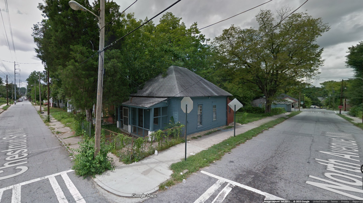 The patrol car left the roadway and hit this home, then caught fire, the Atlanta Police Department reports.
