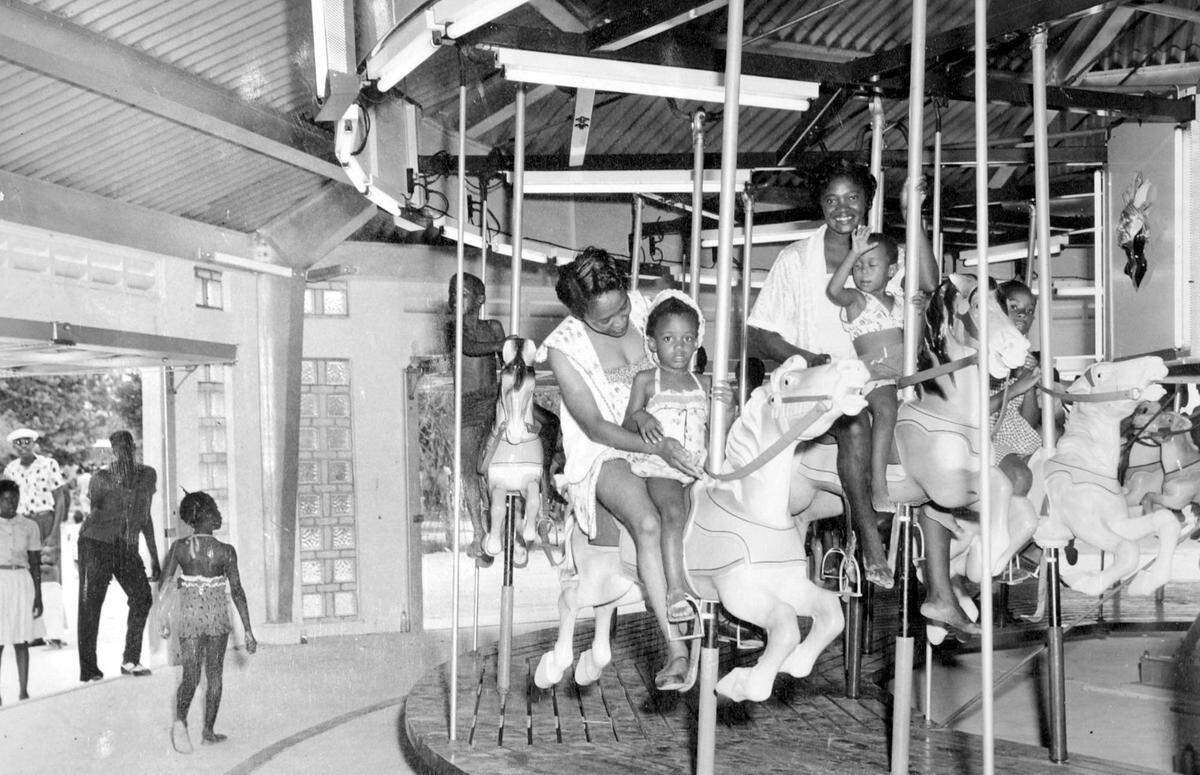 A 1956 photograph shows the merry-go-round in operation at Viriginia Key Beach Park in Viriginia Key, Fla. The park was the only recreation area available to Blacks in Miami during segregation. (Courtesy of Miami-Dade Office of Historic Preservation)