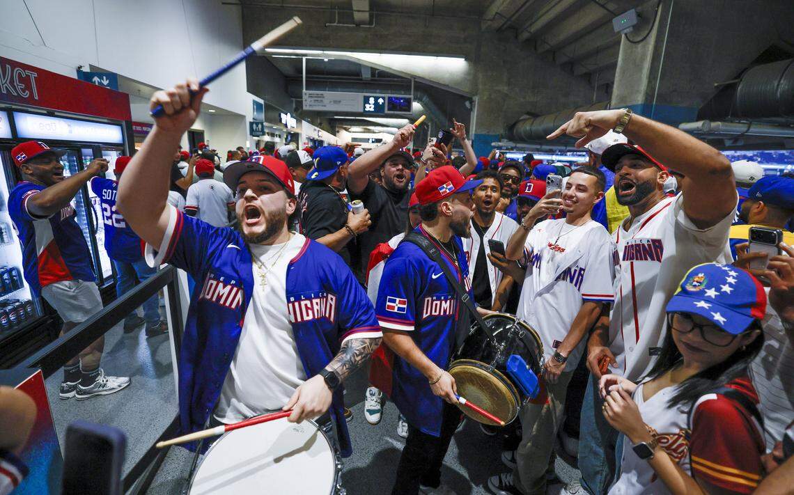 Baseball fans chant to the drums before the game between Dominican Republic and Venezuela during the World Baseball Classic at loanDept park on Wednesday, March 11, 2026.