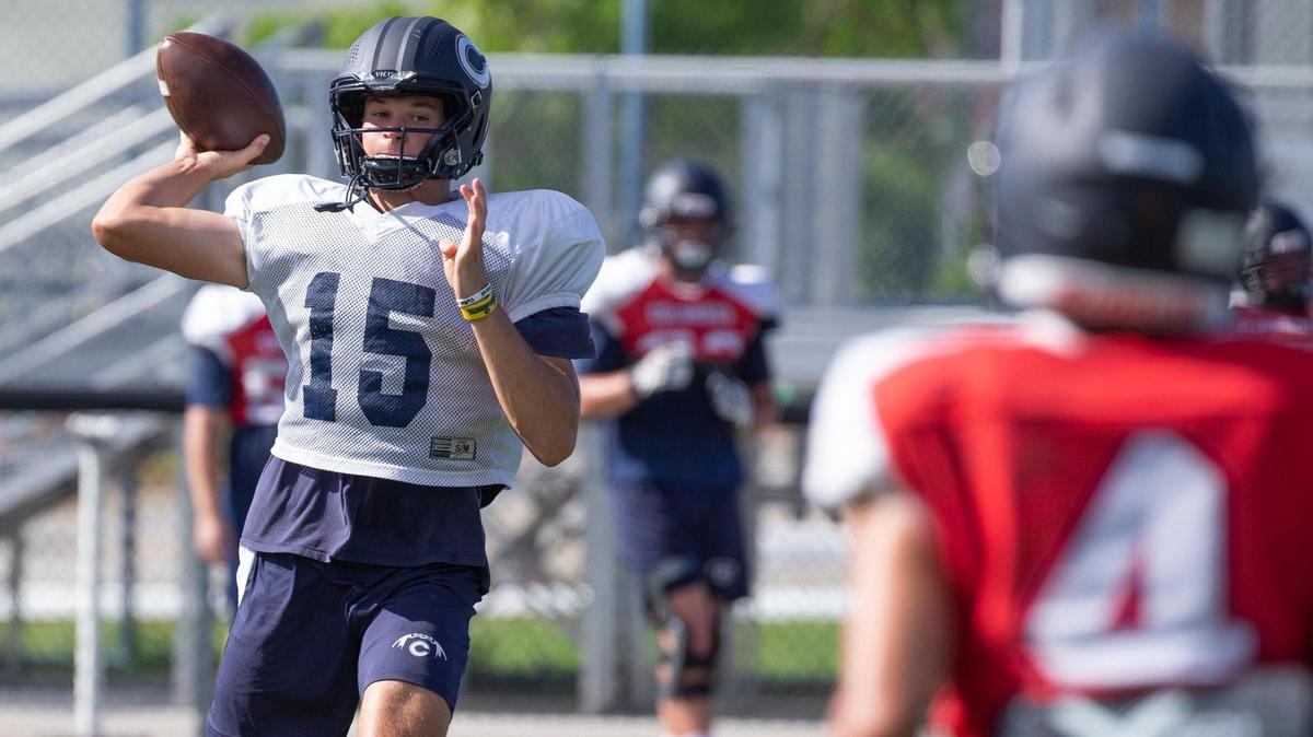 Christopher Columbus High School quarterback Alberto Mendoza (15) sets up to pass during practice drills on Thursday, August 4, 2022.