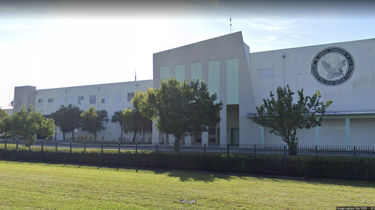 A teacher at John A. Ferguson Senior High School is under investigation after being accused of inappropriate behavior with a student, the district said.
