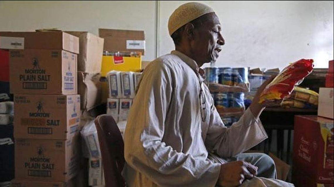 Abdur Rahman, event coordinator and fundraiser for Islamic Foundation of South Florida, sits inside the pantry where food is being collected for the needy during Ramadan.