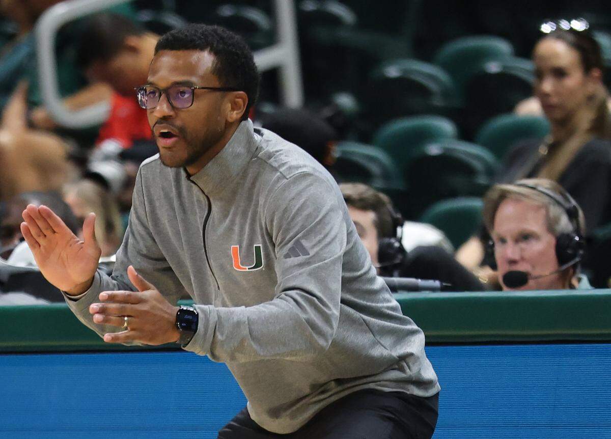 UM head coach Jai Lucas instructs on the sidelines as Miami Hurricanes (4-1) played against Delaware State Hornets in the first half at the Watsco Center in Coral Gables, on Sunday, November 23, 2025.