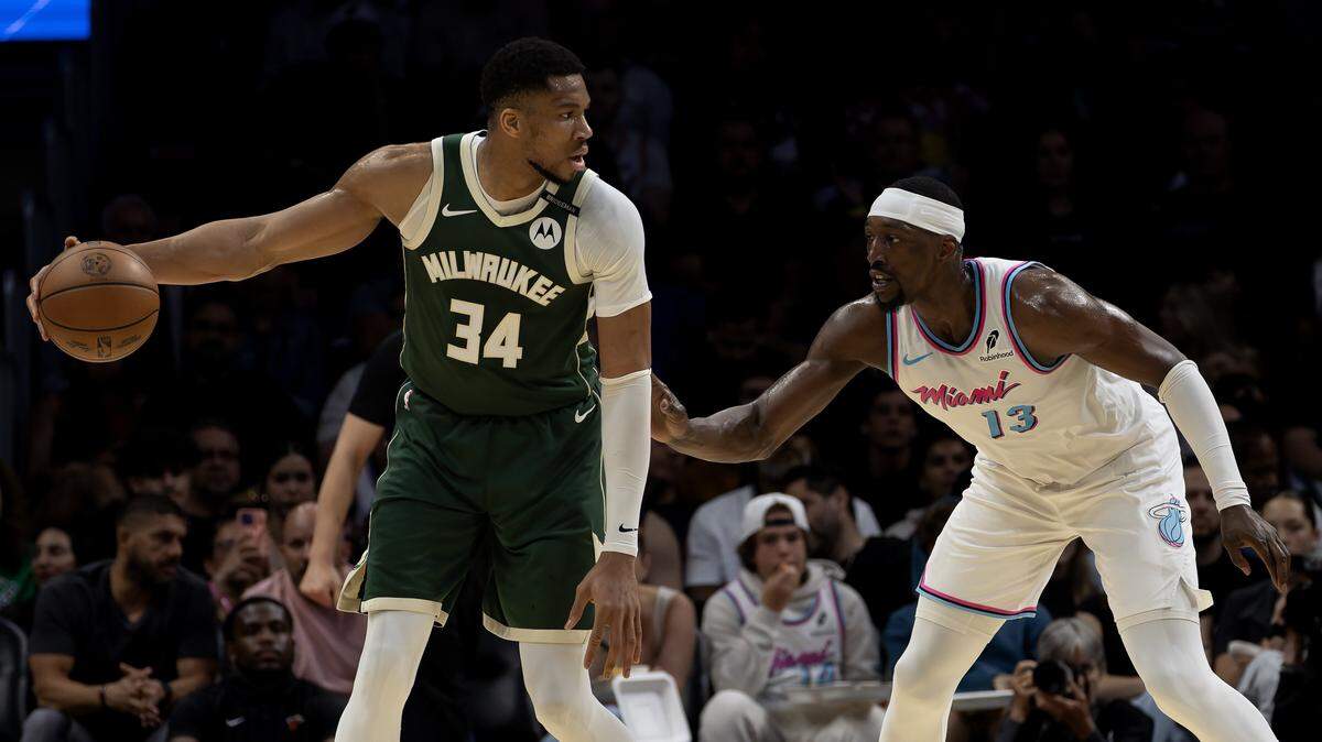 Miami Heat center Bam Adebayo (13) guards Milwaukee Bucks forward Giannis Antetokounmpo (34) during the first half of their matchup at Kaseya Center in Miami, Florida, on Saturday, April 5, 2025.