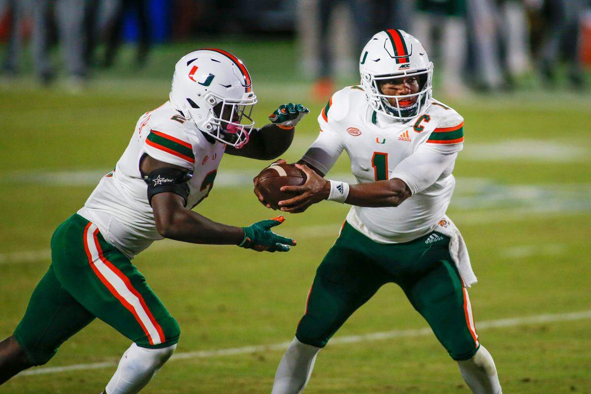 Dec 5, 2020; Durham, North Carolina, USA; Miami Hurricanes quarterback D’Eriq King (1) hands off to running back Donald Chaney Jr. against the Duke Blue Devils in the second quarter at Wallace Wade Stadium. Mandatory Credit: Nell Redmond-USA TODAY Sports