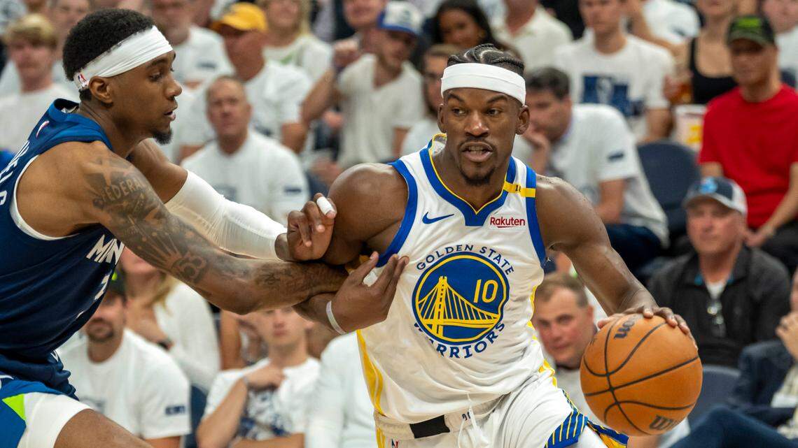 Golden State Warriors forward Jimmy Butler III (10) drives to the basket past Minnesota Timberwolves forward Jaden McDaniels (3) in the second half during game five of the second round for the 2025 NBA Playoffs at Target Center.