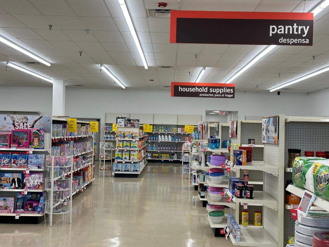 The pantry and household supplies sections inside a room of the Kendale Lakes Kmart on Aug. 23, 2024. Some of the shelves, especially toward the back of the store, are barren, or close to it, with single items placed on them with no replacements in sight.
