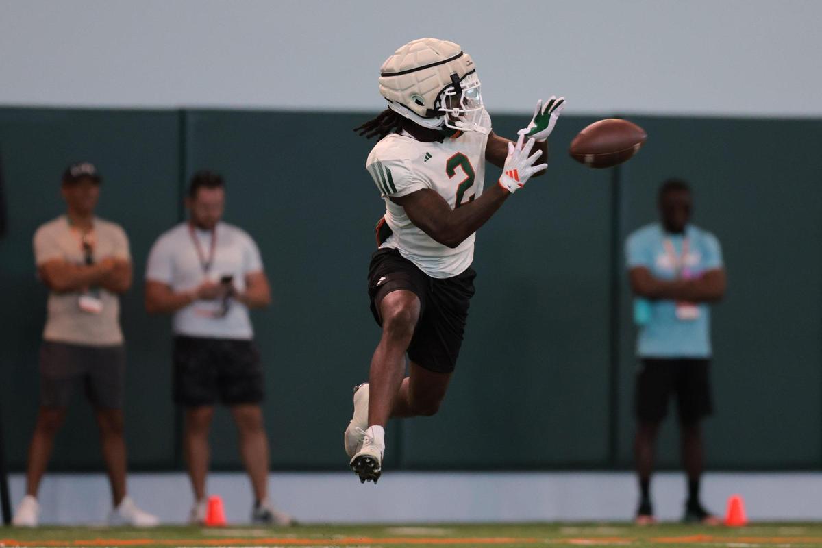 Miami Hurricanes defensive back Damari Brown (2) catches a football during spring practice at the Carol Soffer Indoor Practice Facility at the University of Miami in Coral Gables, Florida, Tuesday, April 1, 2025.