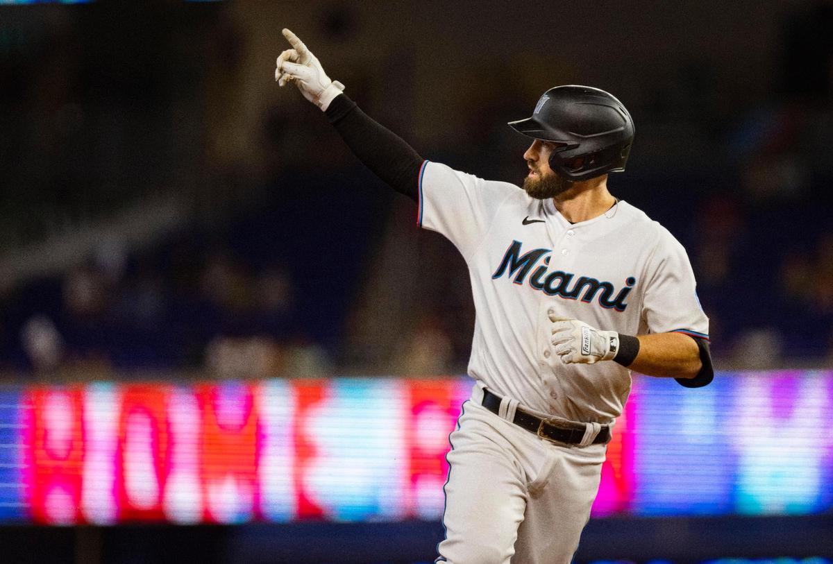 Miami Marlins shortstop Jon Berti (5) points to the outfield after hitting a home run during the second inning of a baseball game against the Milwaukee Brewers on Sunday, Sept. 24, 2023, at loanDepot Park in Miami.