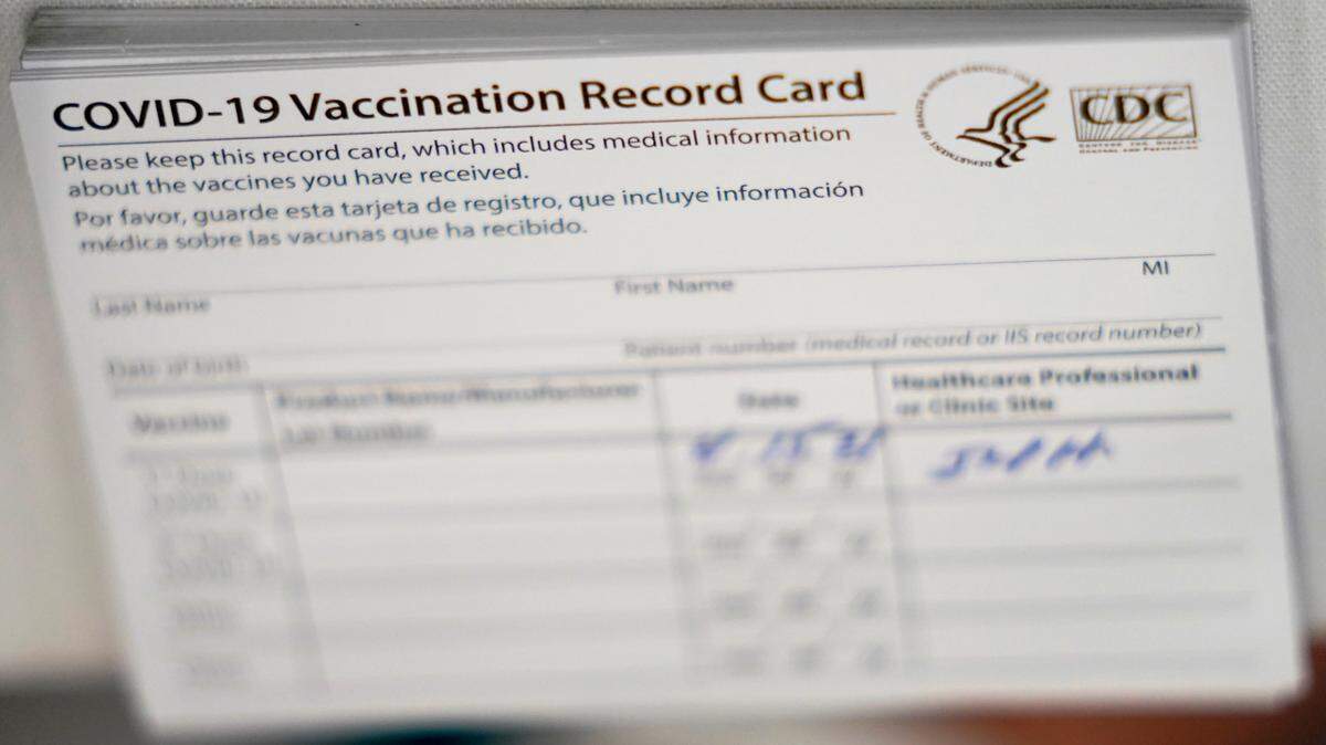 In this stock photo, COVID-19 vaccination cards are shown at the Christine E. Lynn Rehabilitation Center at Jackson Memorial hospital, April 15, 2021, in Miami.