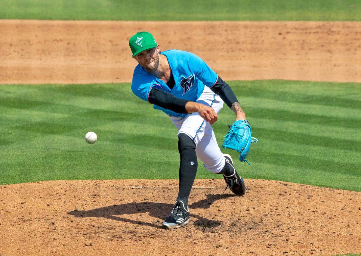 Miami Marlins pitcher Adam Cimber (90) pitches against the New York Mets during the sixth inning of their spring training baseball game at Roger Dean Chevrolet Stadium on Wednesday, March 17, 2021 in Jupiter, Florida.