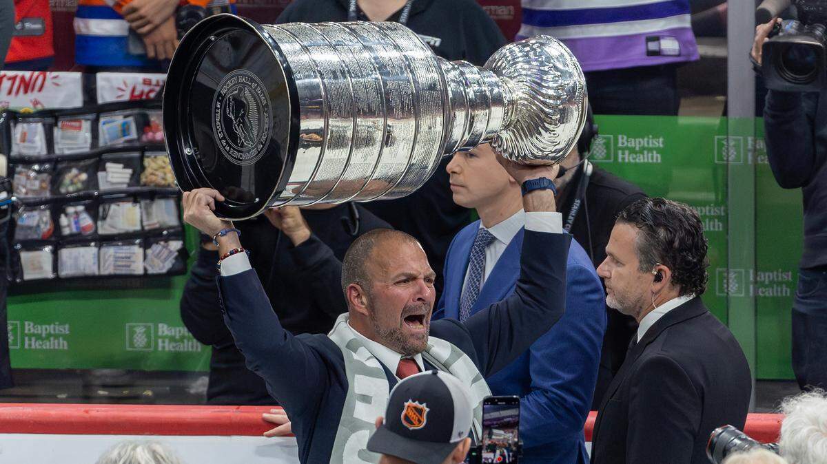 Florida Panthers General Manager, President of Hockey Operations Bill Zito lifts the Stanley Cup after the Panthers defeated the Edmonton Oilers in Game 7 of the NHL Stanley Cup Final at the Amerant Bank Arena on Monday, June 24, 2024, in Sunrise, Fla.