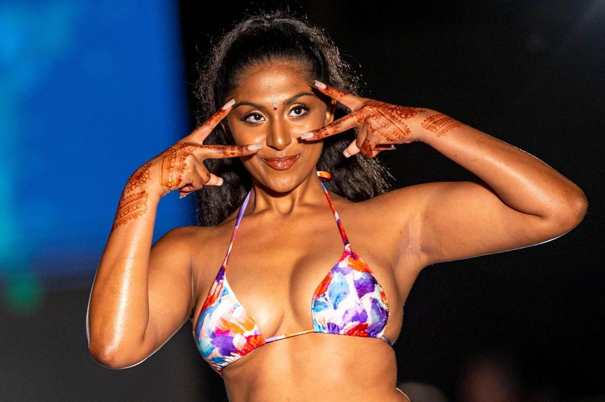 Model Manju Bangalore walks the runway during the 2022 Sports Illustrated Swimsuit Runway Show at the W South Beach beachfront pool in Miami Beach, Florida, on Saturday, July 16, 2022.