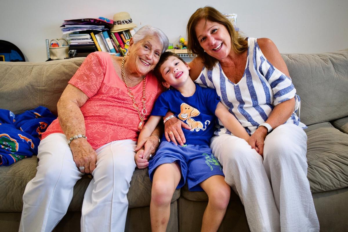 Elena Chavez, left, and Elena Blasser with their great grandson/grandson, John Rodriguez. Chavez, 87, and her daughter, Blasser, 64, died in the condo collapse in Surfside.