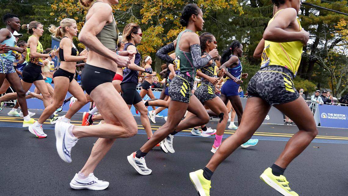 Elite women’s runners break from the starting line of the 125th Boston Marathon in 2021. The marathon has banned runners in Russia and Belarus from competing this year.