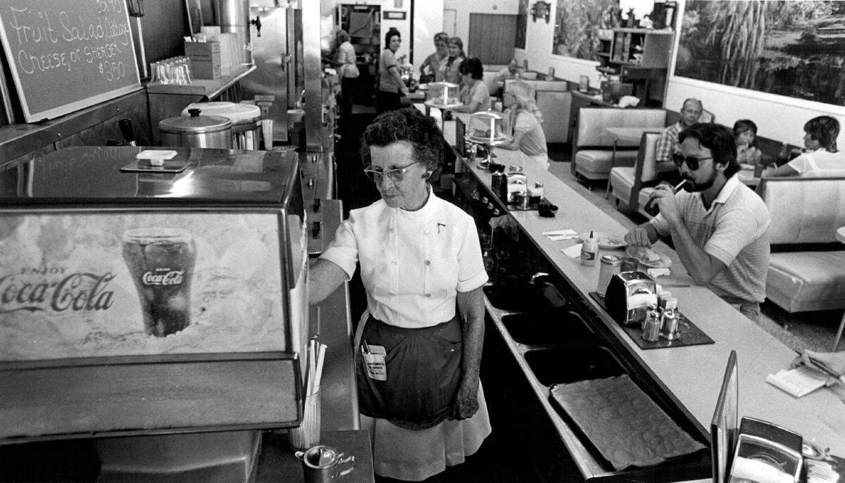 Thelma Cuppy fills up a glass of coke just like she has for 27 Years at the Royal Palms Grill (drugstore) at 806 N Krome Ave in Homestead.