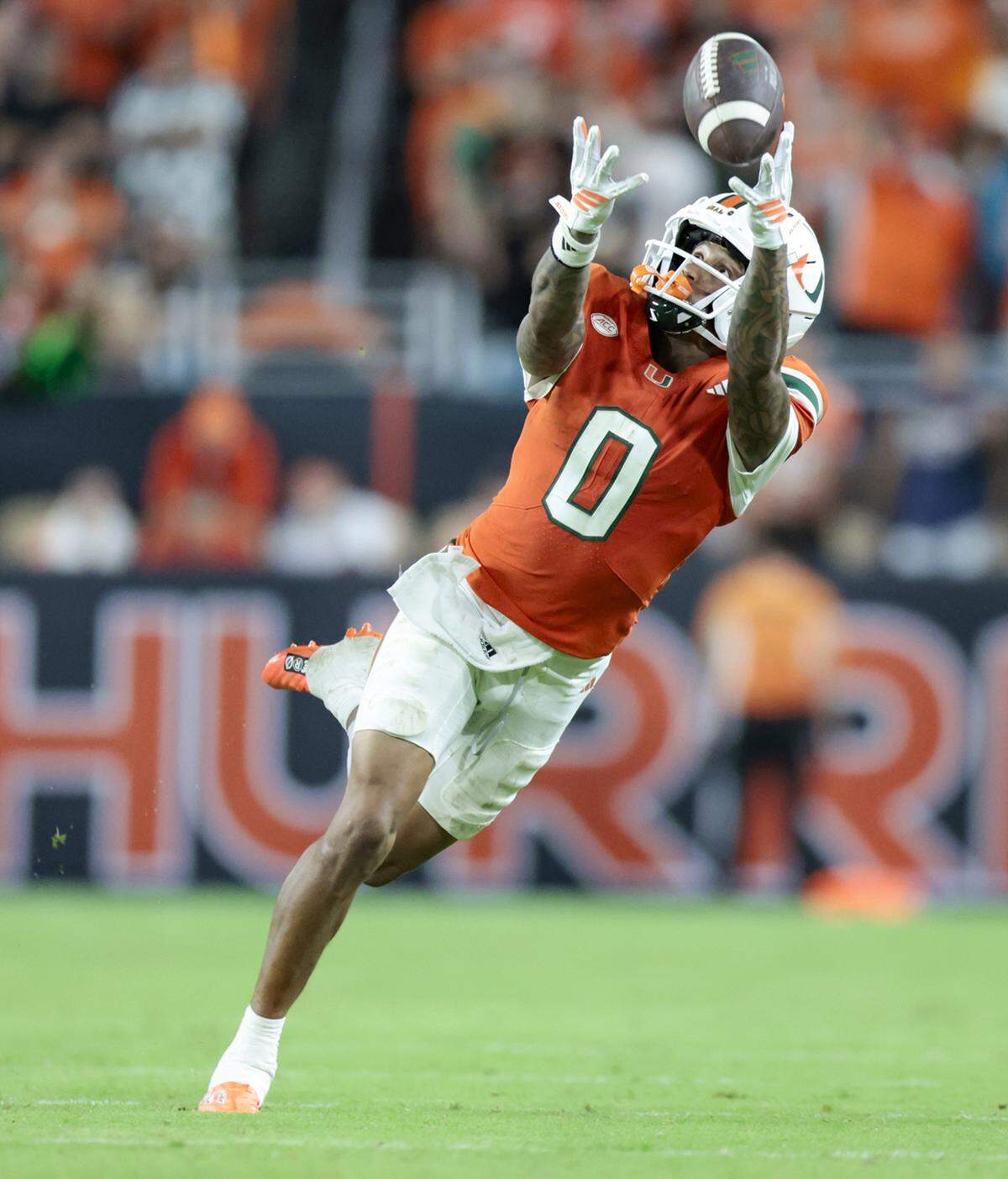 Miami Hurricanes wide receiver Keelan Marion (0) catches a pass for a first down in the second half of an NCAA football game against the South Florida Bulls at Hard Rock Stadium in Miami Gardens, Florida, on Saturday, September 13, 2025.