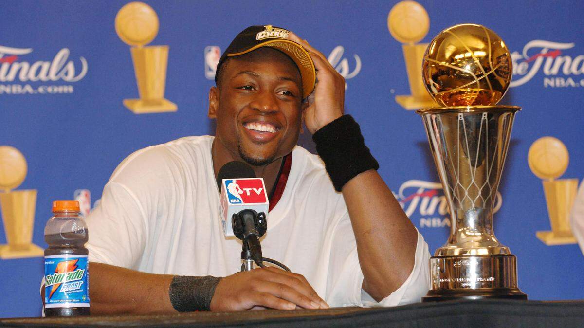 Dwyane Wade #3 of the Miami Heat speaks to the media after winning the NBA Championship in Game Six of the 2006 NBA Finals on June 20, 2006 at the American Airlines Center in Dallas.