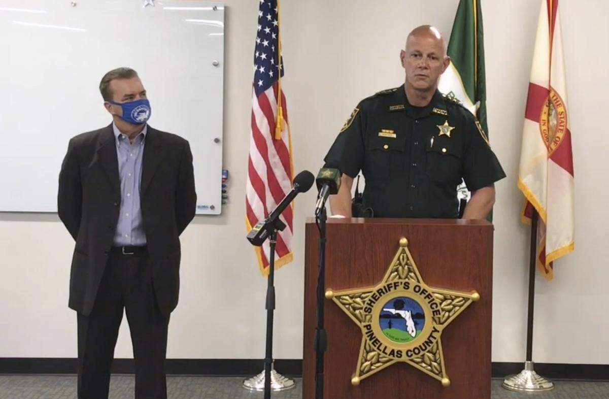 In this screen shot from a YouTube video posted by the Pinellas County Sheriff’s Office, Pinellas County Sheriff Bob Gualtieri speaks during a news conference as Oldsmar, Fla., Mayor Eric Seidel, left, listens, Monday, Feb. 8, 2021, in Oldsmar, Fla. Authorities say a hacker gained access to Oldsmar’s water treatment plant in an unsuccessful attempt to taint the water supply with a caustic chemical.