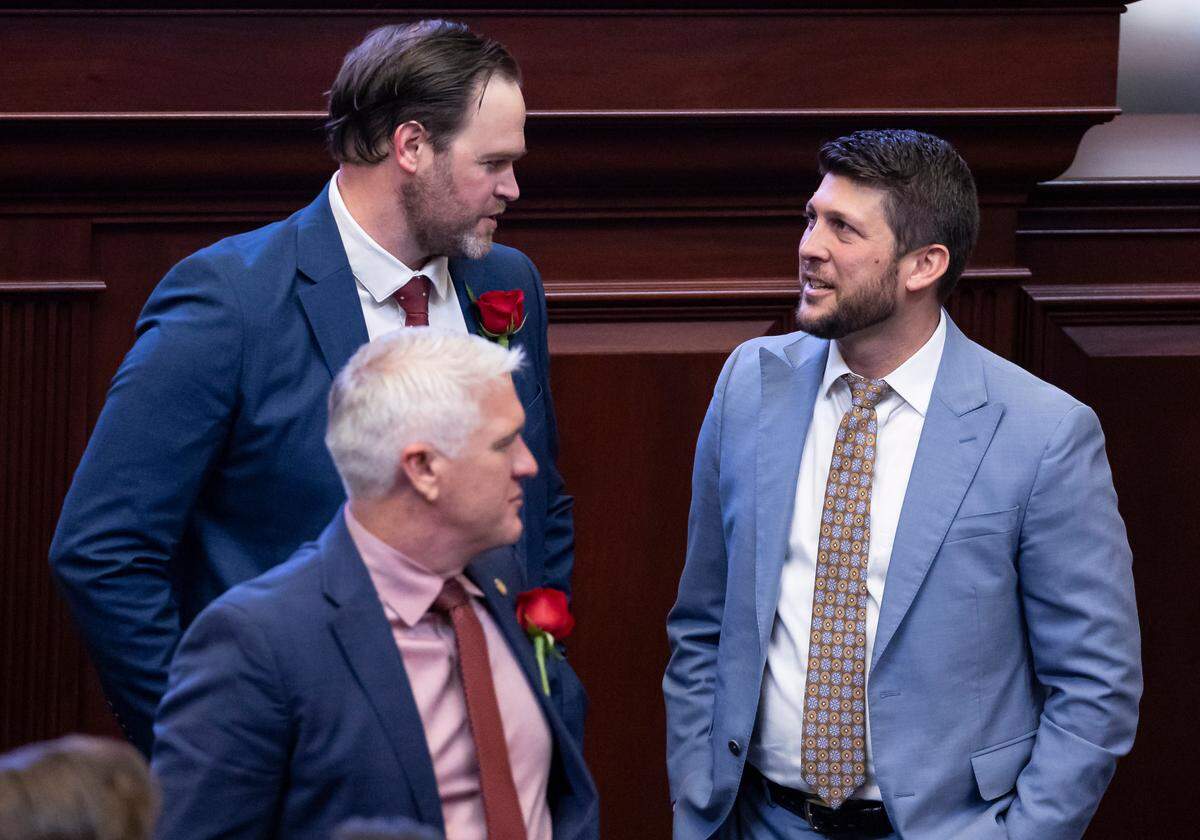 Florida State Rep. Alex Andrade, R-Pensacola, and Florida Attorney General James Uthmeier talk during the first day of the legislative session at the Florida State Capitol on Tuesday, March 4, 2025, in Tallahassee, Fla.