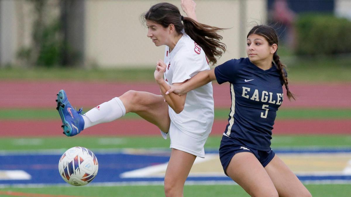Cardinal Gibbons Molly Santos (22) attempts to kick the ball during Region 4-4A girls soccer semifinal game against North Broward Prep School on Friday, February 9, 2024 at North Broward Prep School in Coconut Creek. Andrew Uloza / for Miami Herald