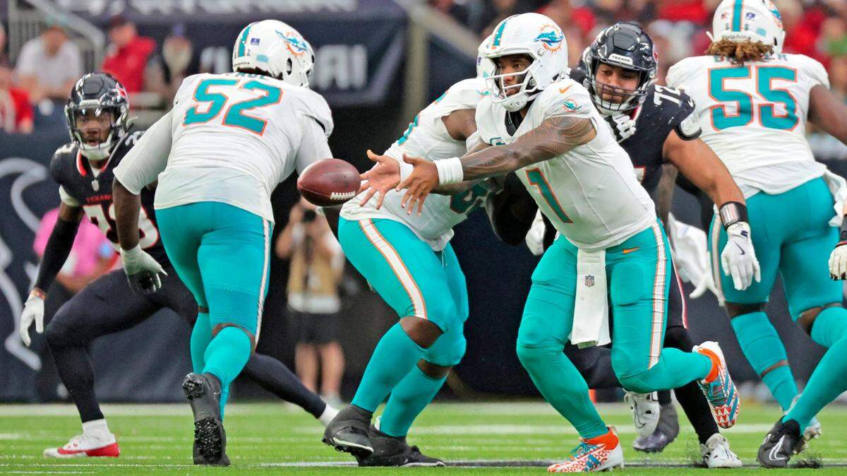 Miami Dolphins quarterback Tua Tagovailoa (1) pitches the ball in the second half against the Houston Texans during their NFL football game at NRG Stadium in Houston, Texas, on Sunday, December 15, 2024.