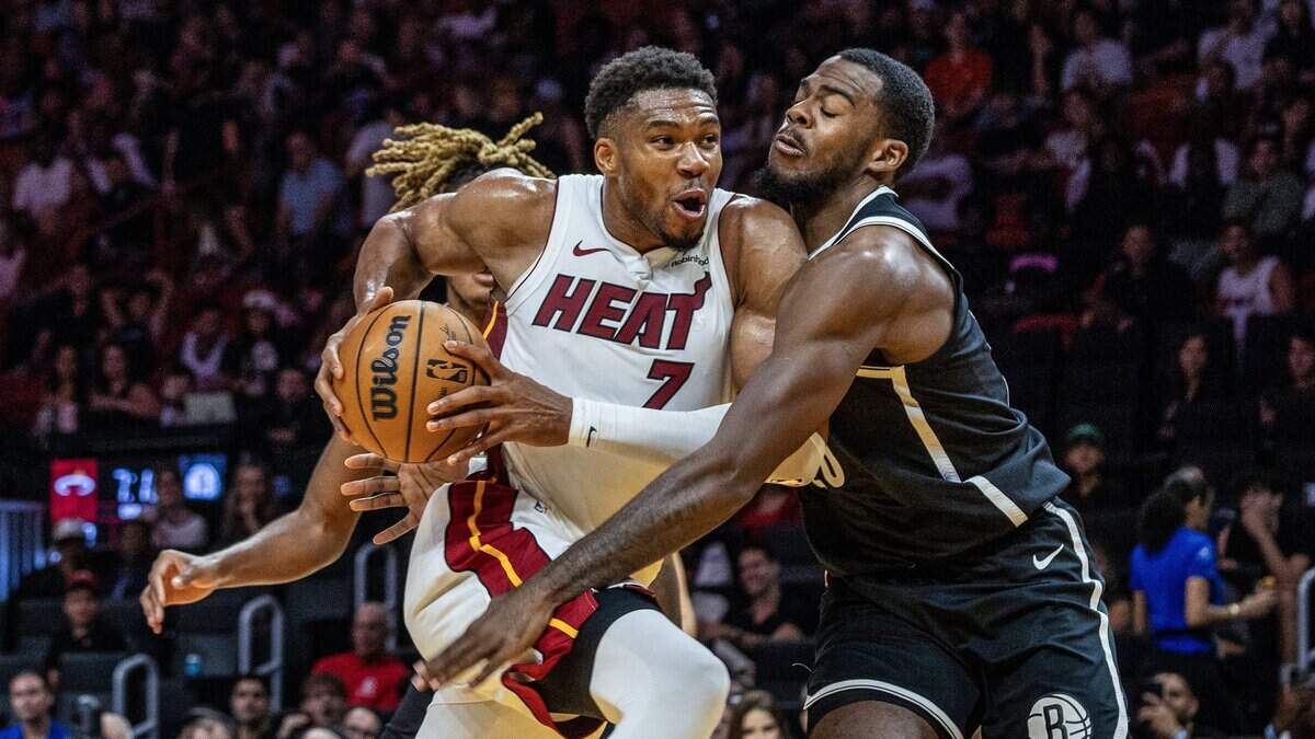 Miami Heat forward Giannis Antetokounmpo (7) drives to the basket against Brooklyn Nets forward Noah Clowney (21), in the second half of their preseason NBA basketball game at Kaseya Center, in Miami on October 14, 2026.